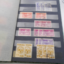 Lot de timbres de Vietnam neufs et oblitérés en 7 albums.
