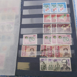 Lot de timbres de Vietnam neufs et oblitérés en 7 albums.