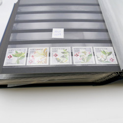 Lot de timbres de Vietnam neufs et oblitérés en 7 albums.