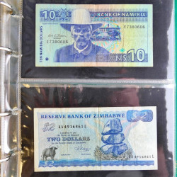 Lot de 50 billets de banque anciens du monde en album.