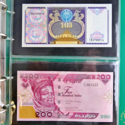 Lot de 50 billets de banque anciens du monde en album.