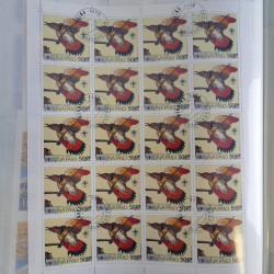 Lot de timbres en feuilles divers pays, thématiques, variétés en album.