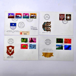 Lot de 260 enveloppes FDC timbres Suisse 1965-1984 en une boite.
