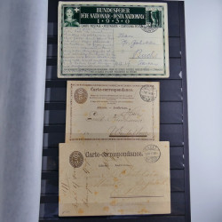 Suisse ensemble d'entiers postaux neuf et oblitérés en un album.