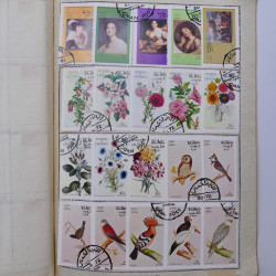 Vrac philatélique de timbres du monde neufs et oblitérés en un carton.