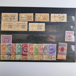 Vrac philatélique de timbres du monde neufs et oblitérés en un carton.