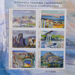 Vrac philatélique de timbres du monde neufs et oblitérés en un carton.