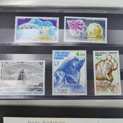 Vrac philatélique de timbres du monde neufs et oblitérés en un carton.