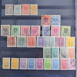 Vrac philatélique de timbres du monde neufs et oblitérés en un carton.