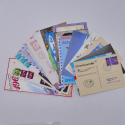 Vrac philatélique de timbres du monde neufs et oblitérés en un carton.