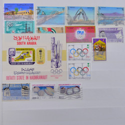 Lot de timbres d'Arabie neufs et oblitérés en un album.