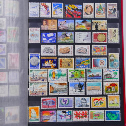 Lot de timbres de Monaco - Finlande neufs et oblitérés en un album.