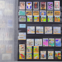 Lot de timbres d'Australie 1912-2003 neufs et oblitérés en un album.