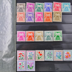 Vrac philatélique de timbres du monde neufs et oblitérés en un carton.