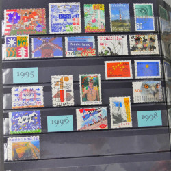 Lot de timbres d'Autriche, Pays Bas, Portugal en un album.