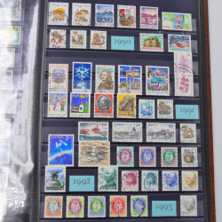 Lot de timbres de Nouvelle Zélande, Norvège neufs et oblitérés en un album.