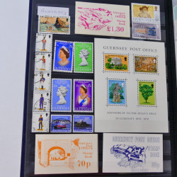 Lot de timbres de Maldives, Guernesey, Honduras neufs et oblitérés en un album.