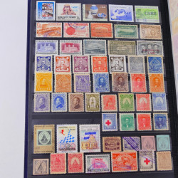 Lot de timbres de Maldives, Guernesey, Honduras neufs et oblitérés en un album.