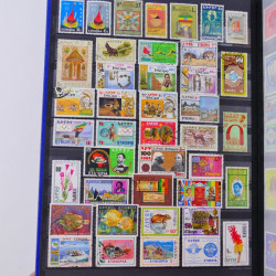 Lot de timbres d'Ethiopie et Dominique neufs et oblitérés en un album.