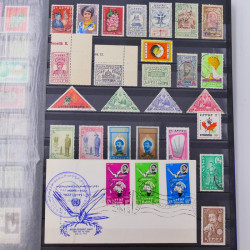Lot de timbres d'Ethiopie et Dominique neufs et oblitérés en un album.