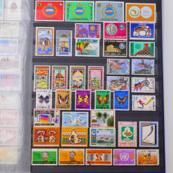 Lot de timbres d'Ethiopie et Dominique neufs et oblitérés en un album.