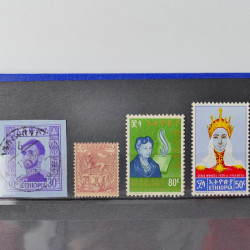 Lot de timbres d'Ethiopie et Dominique neufs et oblitérés en un album.