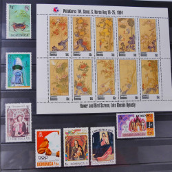 Lot de timbres d'Ethiopie et Dominique neufs et oblitérés en un album.