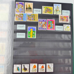 Lot de timbres de Grande Bretagne et Irlande neufs et oblitérés en un album.