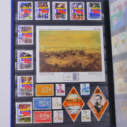 Lot de timbres de Venezuela et Papouasie neufs et oblitérés en un album.