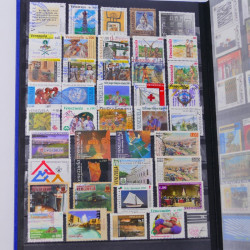 Lot de timbres de Venezuela et Papouasie neufs et oblitérés en un album.