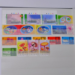 Lot de timbres de Hong Kong neufs et oblitérés en un album.