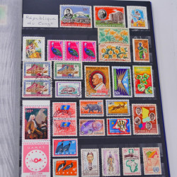 Lot massif de timbres du monde neufs et oblitérés en 8 albums.