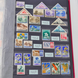 Lot massif de timbres du monde neufs et oblitérés en 8 albums.