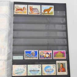 Lot massif de timbres du monde neufs et oblitérés en 9 albums.
