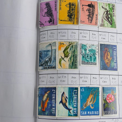 Vrac massif de timbres du monde neufs et oblitérés en un carton.