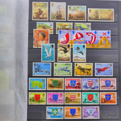 Lot de timbres de Jersey oblitérés en un album.