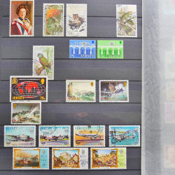 Lot de timbres de Jersey oblitérés en un album.