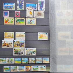 Lot de timbres de Jersey oblitérés en un album.