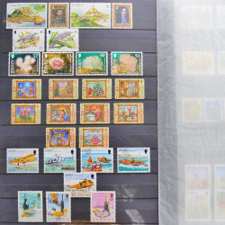 Lot de timbres de Jersey oblitérés en un album.