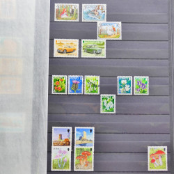 Lot de timbres de Jersey oblitérés en un album.