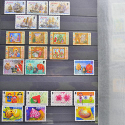 Lot de timbres de Jersey oblitérés en un album.