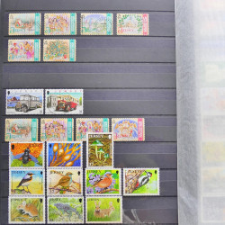 Lot de timbres de Jersey oblitérés en un album.
