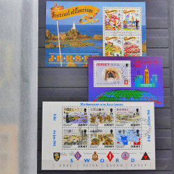 Lot de timbres de Jersey oblitérés en un album.
