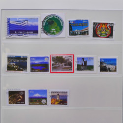 Vrac philatélique de timbres du monde neufs et oblitérés en un carton.