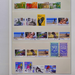 Vrac philatélique de timbres du monde neufs et oblitérés en un carton.