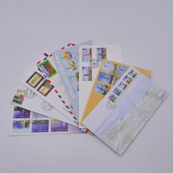 Vrac philatélique de timbres du monde neufs et oblitérés en un carton.