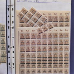 Vrac philatélique de timbres du monde neufs et oblitérés en un carton.