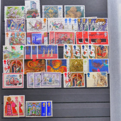 Vrac philatélique de timbres du monde neufs et oblitérés en un carton.