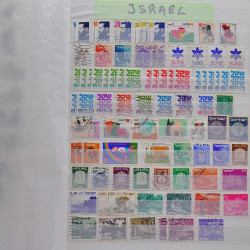 Vrac philatélique de timbres du monde neufs et oblitérés en un carton.