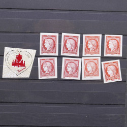 Vrac philatélique de timbres du monde neufs et oblitérés en un carton.